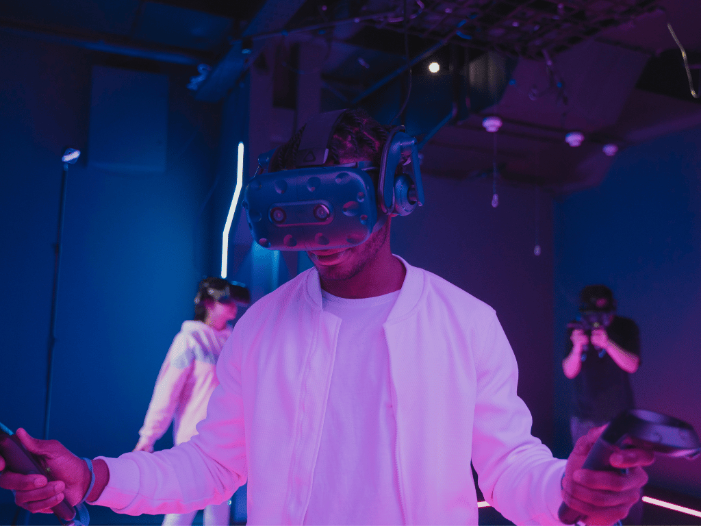 man with a virtual reality headset on playing a VR game 