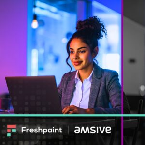 Professional woman with curly hair in a bun, wearing a plaid blazer over a white shirt, smiling while working on a laptop in a modern office space. The scene is dramatically lit with purple and blue neon lighting, creating a vibrant, tech-forward atmosphere. The Freshpaint and Amsive company logos appear at the bottom of the image.