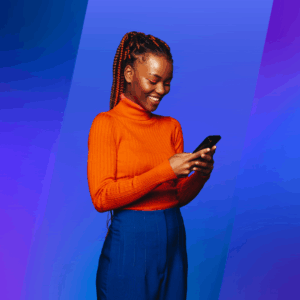 A woman wearing an orange turtleneck and blue pants smiles while looking at her phone. The background features a smooth gradient of blue and purple, creating a vibrant and modern feel.