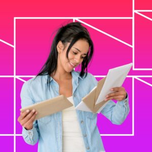 A woman smiles while looking down at two opened envelopes in her hands, standing against a bright pink gradient background with white geometric line patterns, suggesting anticipation and positive engagement.s