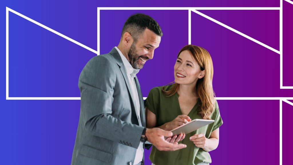 Two professionals smile while reviewing information on a tablet together, standing against a blue and purple gradient background with geometric white line patterns, suggesting collaboration and digital strategy planning.